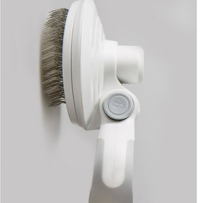 Self-cleaning wire brush for pets